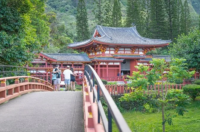 Byodo-In Temple and its bridge with small figures of visitors on the path