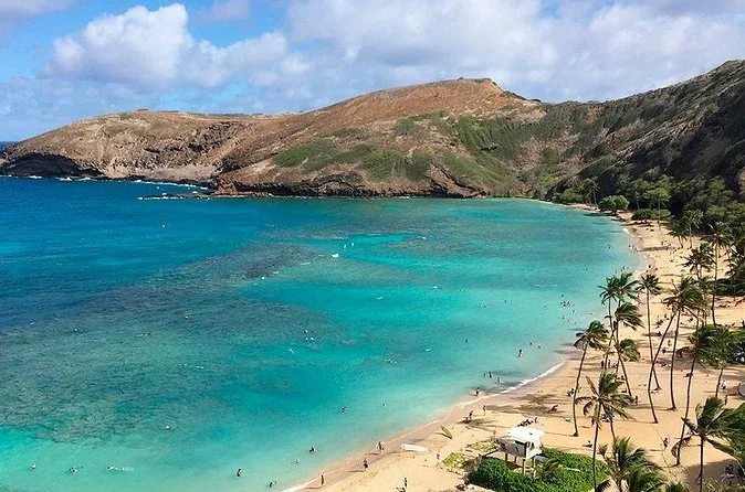 Hanauma Bay's curved reef and beach seen from the rim above